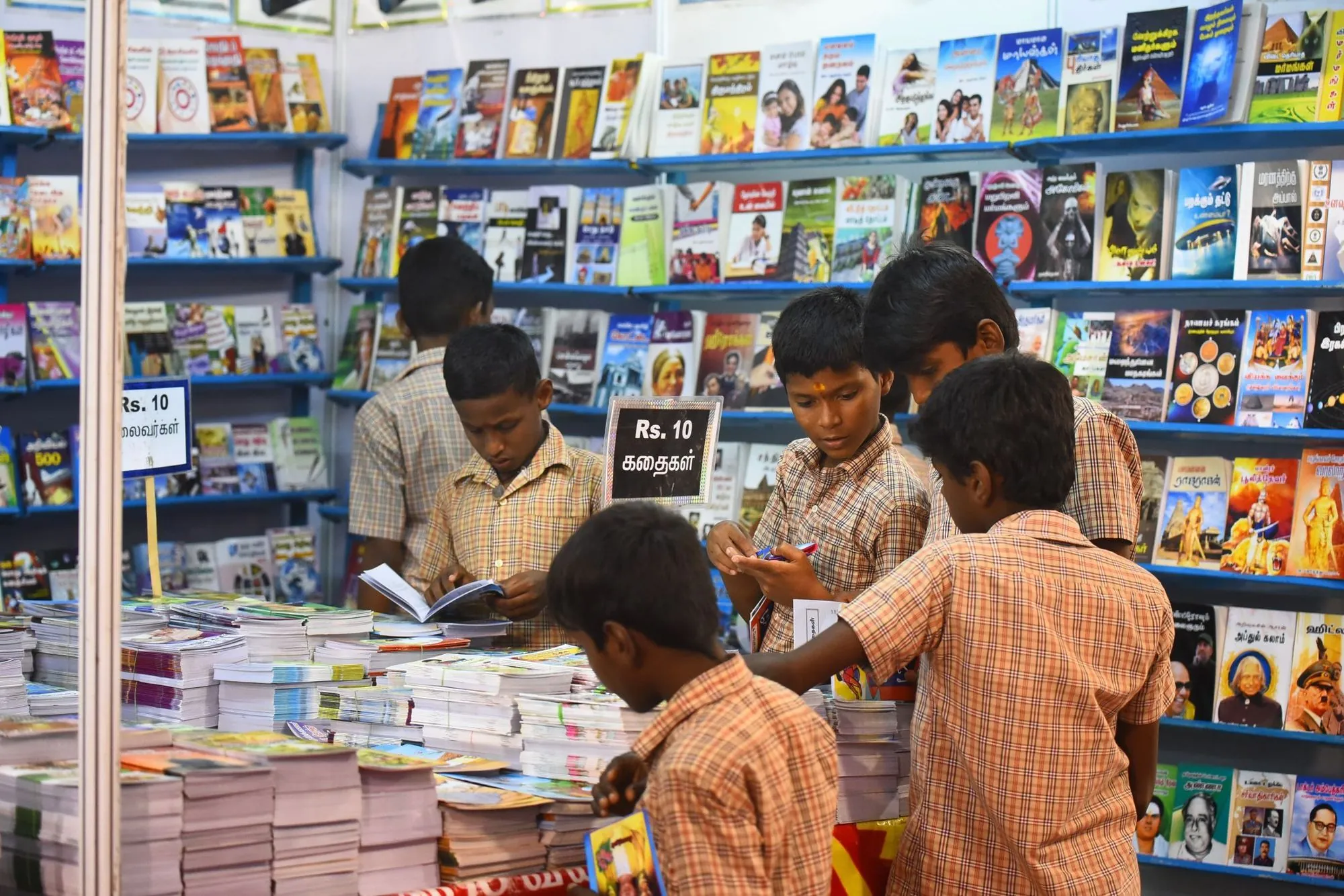 Children browsing books at a book stall