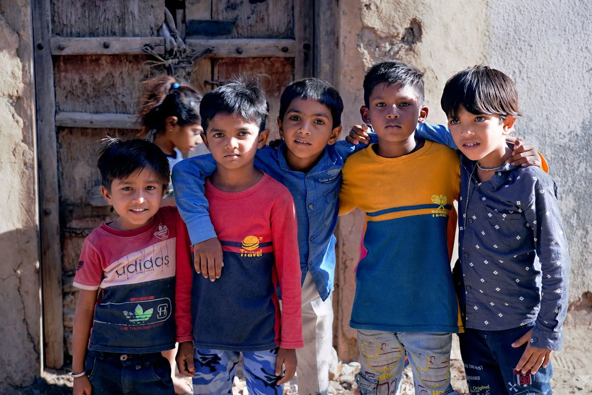 A group of children smiling outdoors