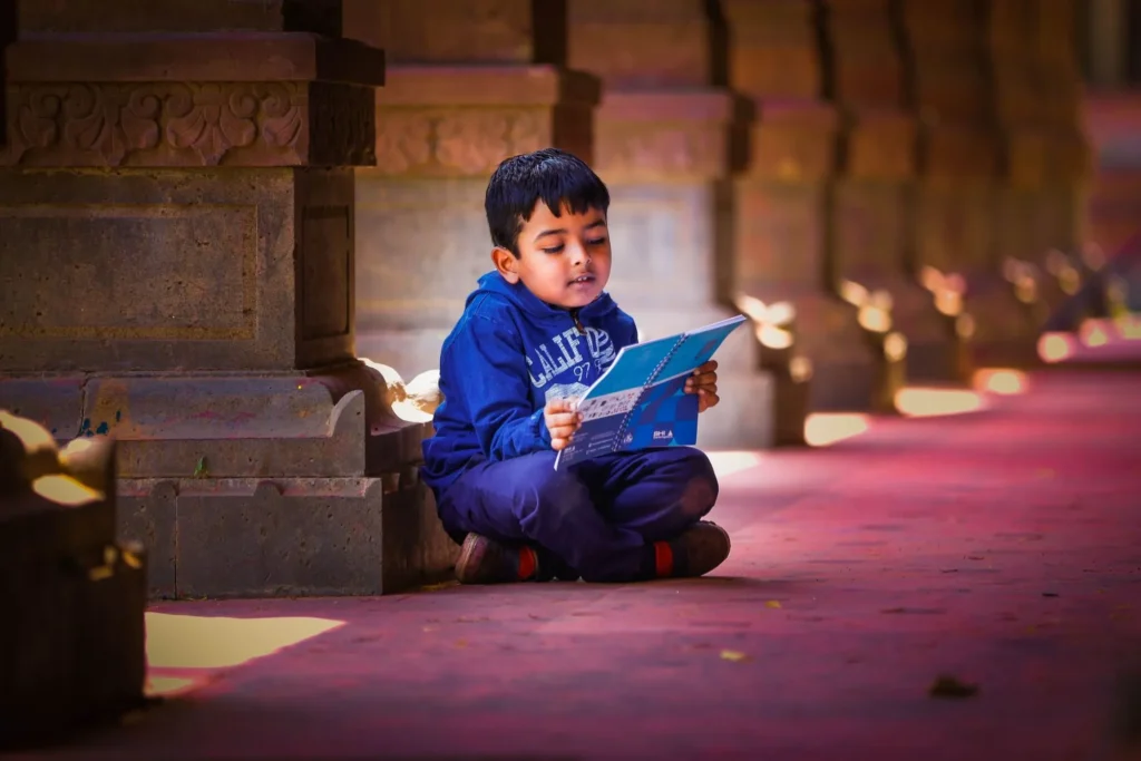 A young boy reading a book